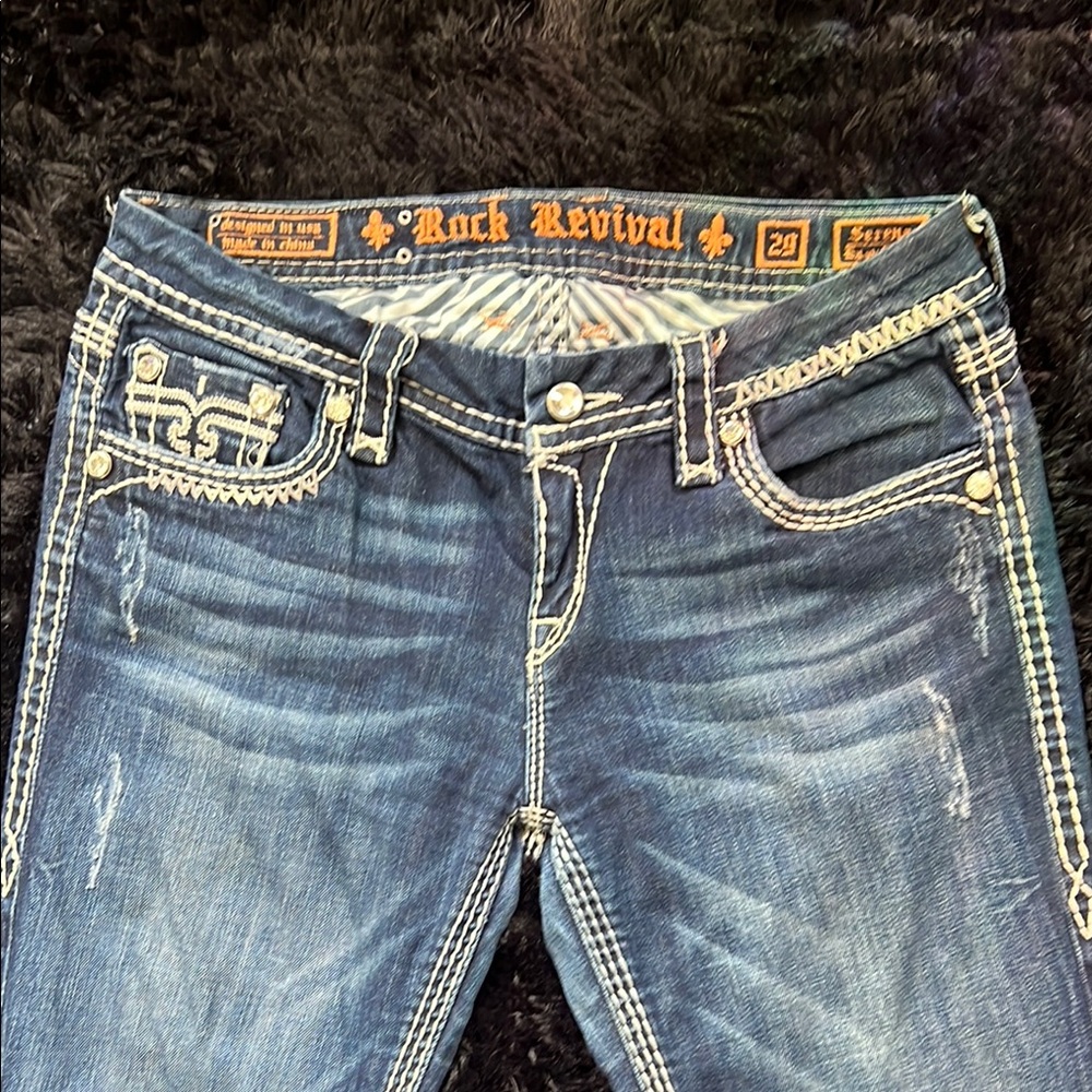 Rock Revival Blue Boot Cut Jeans with Distressed Detailing